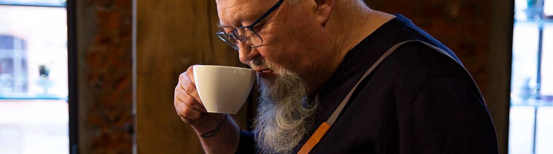 Freddy Schoknecht savours coffee at Eilles Kaffee, showcasing his passion for roasting and brewing quality beans.